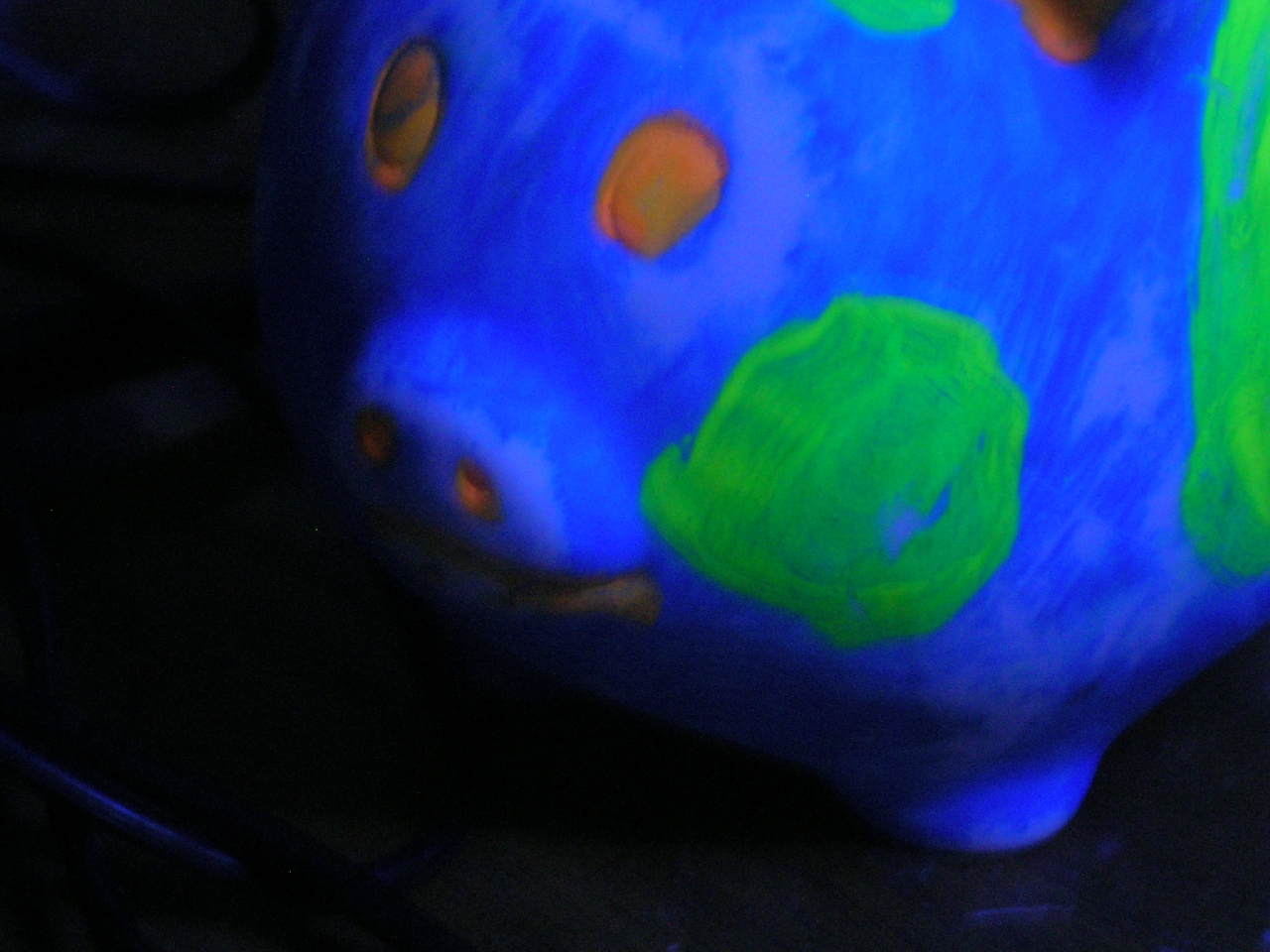 piggy bank under black light